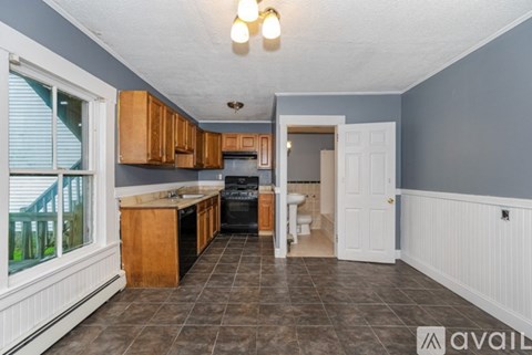 A kitchen with a dining area and a bathroom is available for rent.