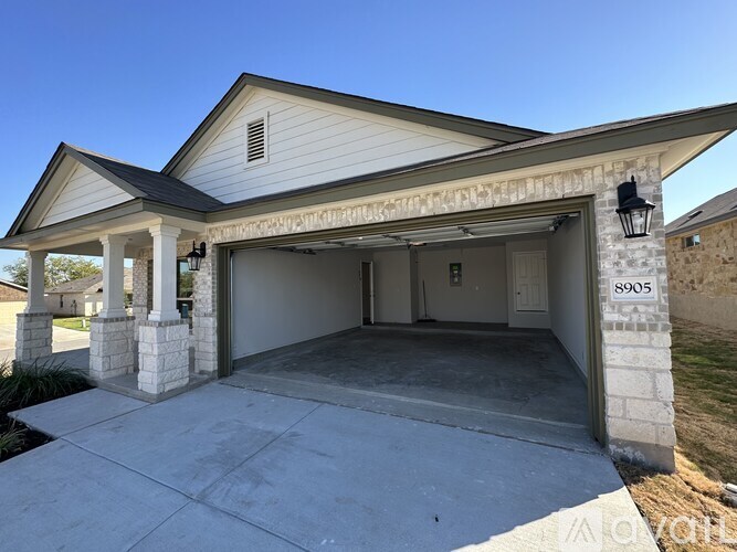 A house with the number 8905 on the side of it.