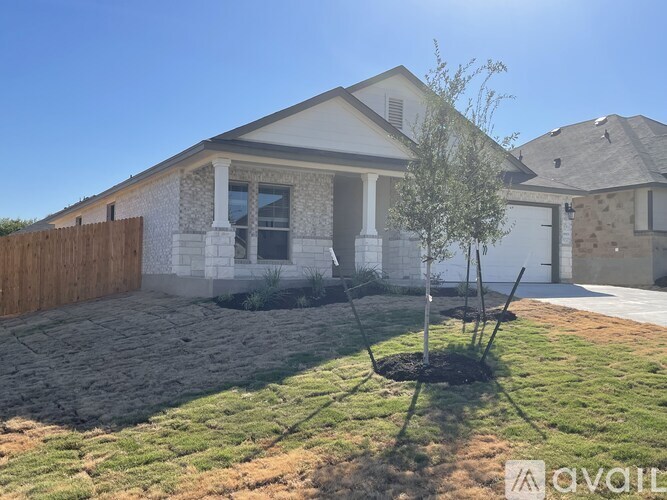A house with a tree in front of it.