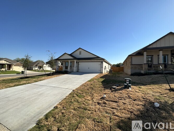 A house with a driveway in front of it.