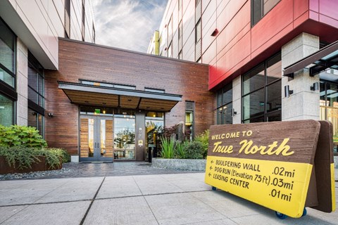 the entrance to time north with a sign that says welcome to true north