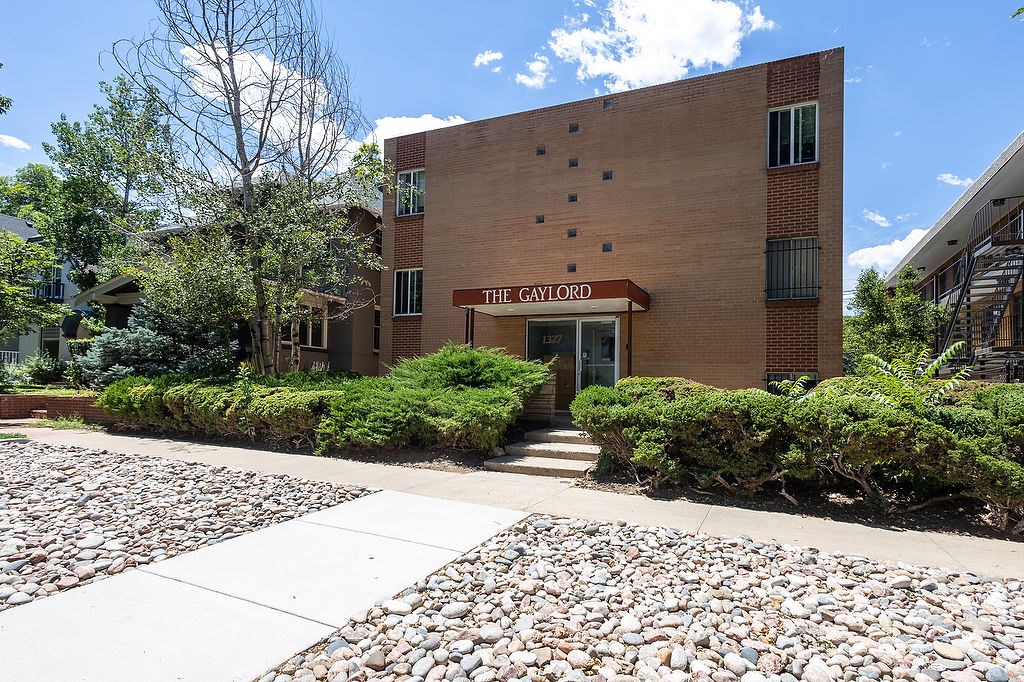 The Gaylorord building is made of brick and has a red sign on the front.