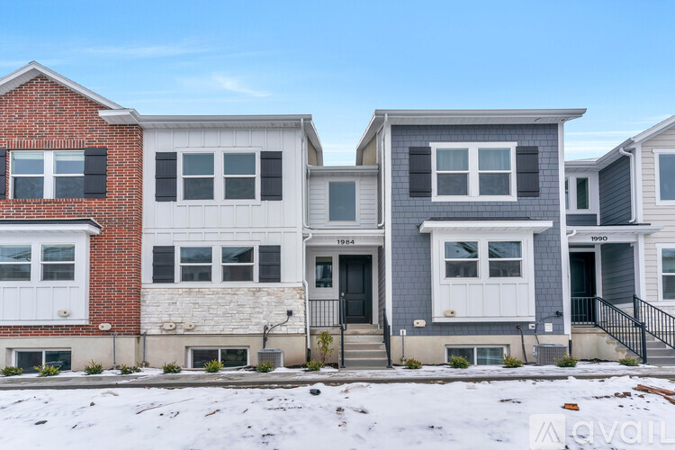 A row of houses with different colored exteriors.