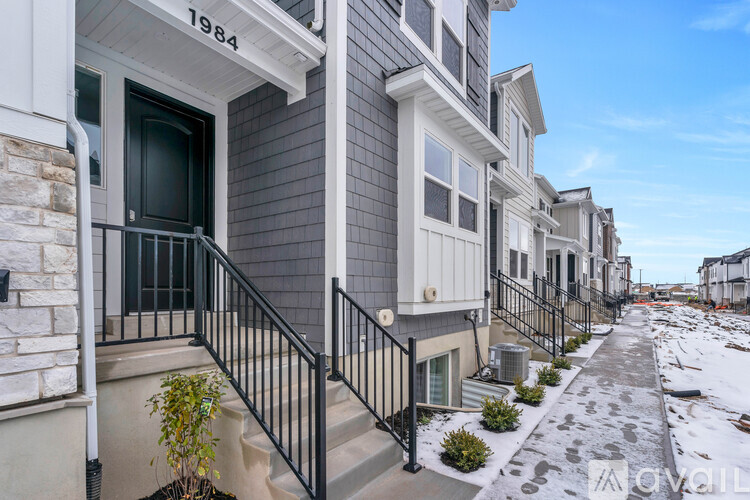 A row of houses with the number 1984 on the first one.