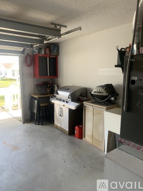 A kitchen area with a stove and a sink.