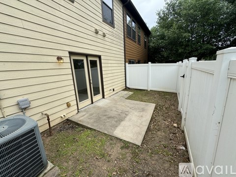 A house with a white fence and a window.