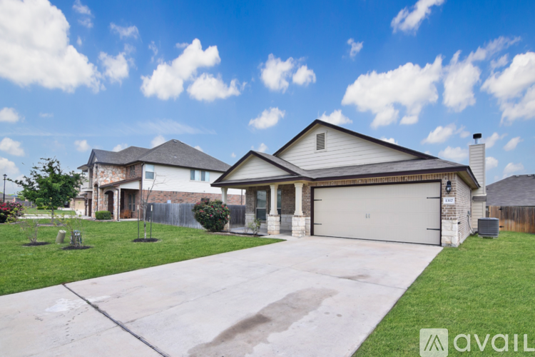 A house with a garage is for sale.