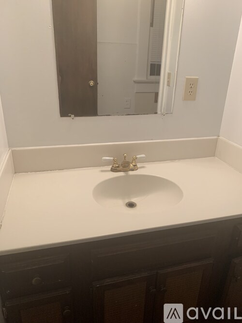 A bathroom sink with a mirror above it.