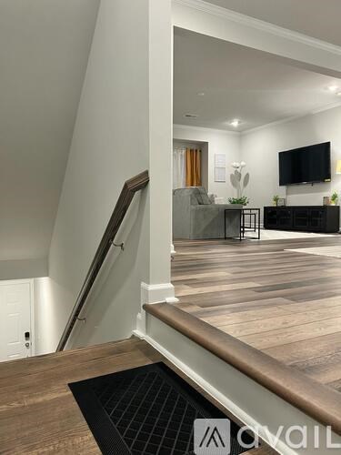 A living room with a television and a couch.