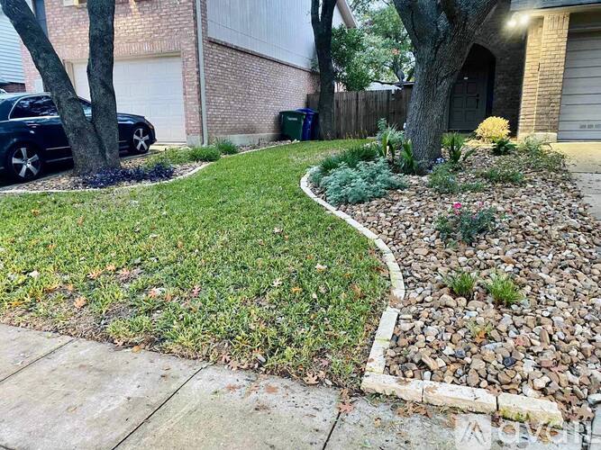 A well-maintained garden with a curved stone pathway.
