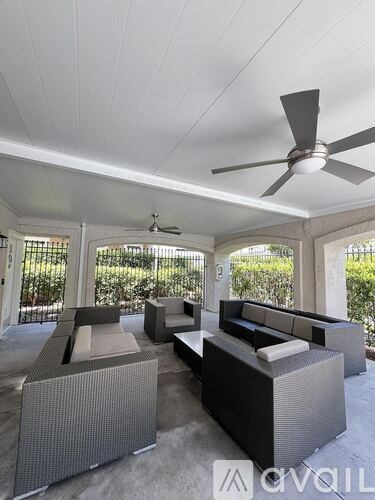 A white bathroom vanity with a sink and a mirror.