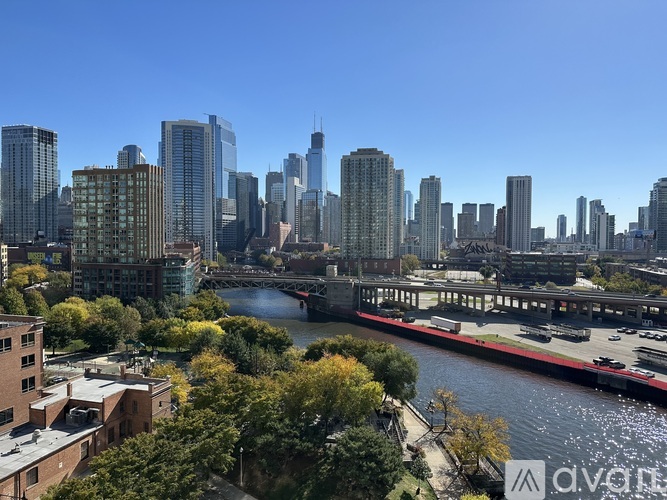 A cityscape with a river running through it.
