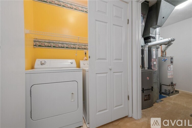 A room with a washer and dryer in it.