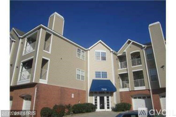 A building with a blue awning and the number 7719 on it.