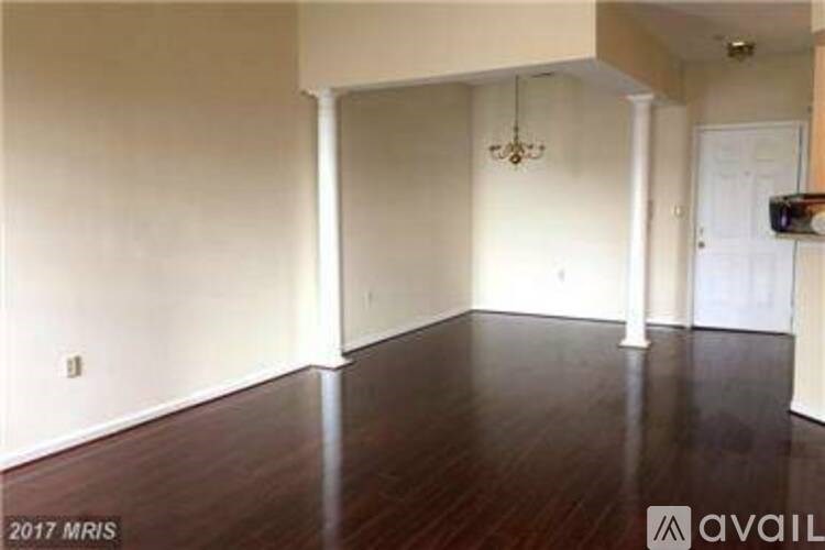 A room with wooden floors and white walls.