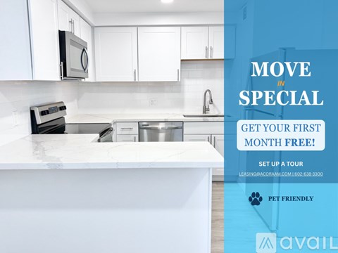 A kitchen with a countertop and cabinets is advertised with a promotion for a free first month.