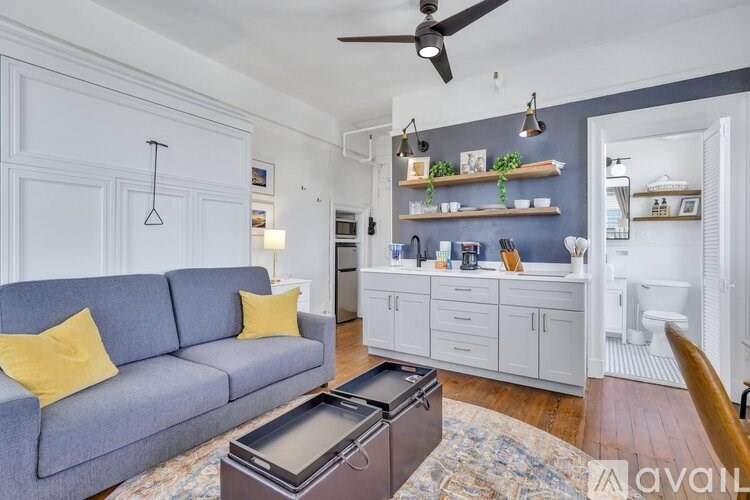 A living room with a grey sofa and a coffee table.