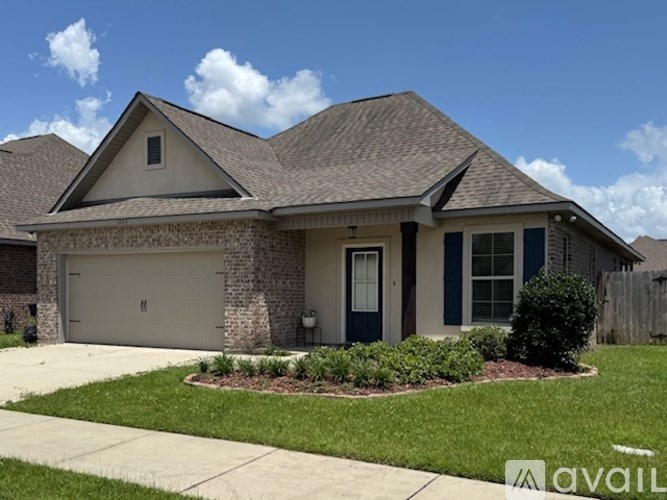 A house with a garage and a driveway.
