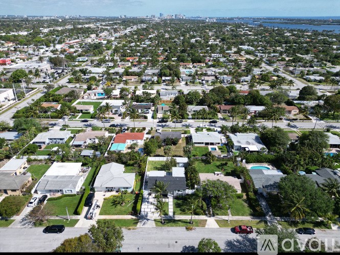A bird's eye view of a residential area with houses and streets.