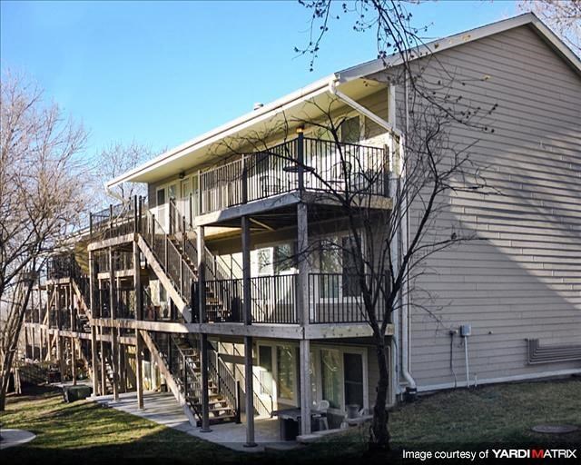 a house with a balcony on the side of it