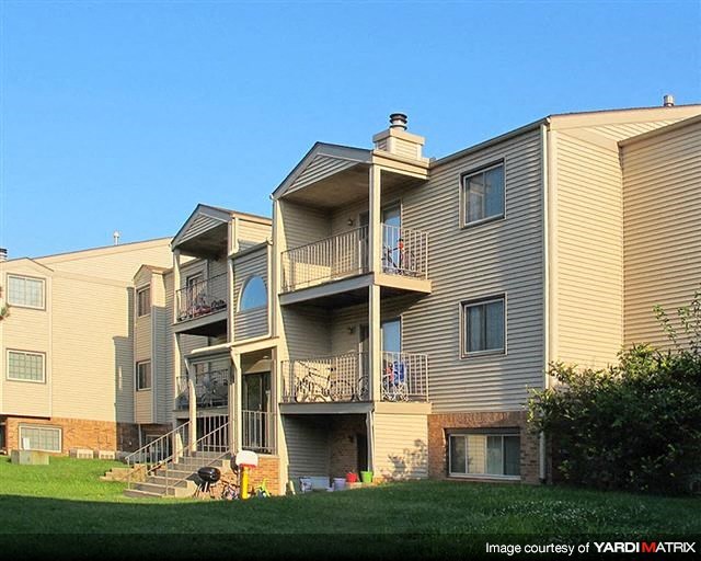 a row of houses with balconies and stairs