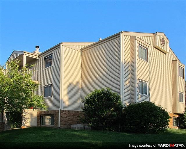 a large house with a yard in front of it