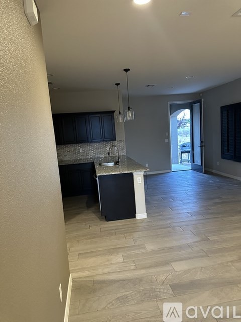 A kitchen with a sink and a counter.