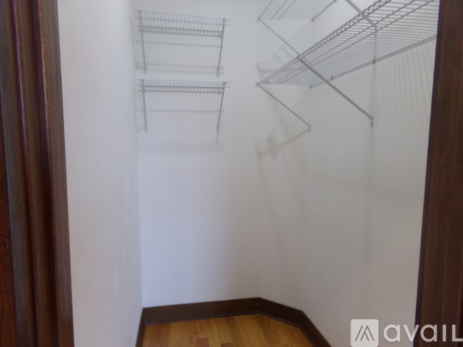 A drawing of a kitchen with shelves is projected on a wall.