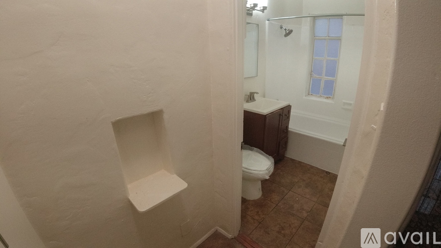 A bathroom with a toilet and a sink.