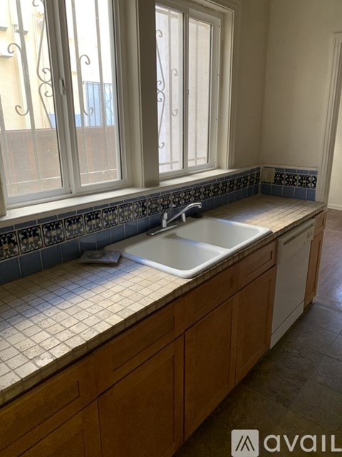 A kitchen with a sink and a window.