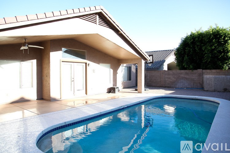 A house with a pool in the backyard.
