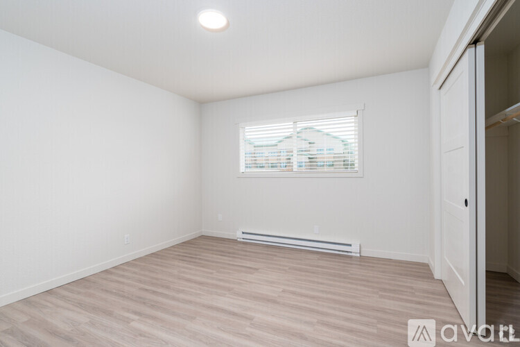 A room with a window and a door.