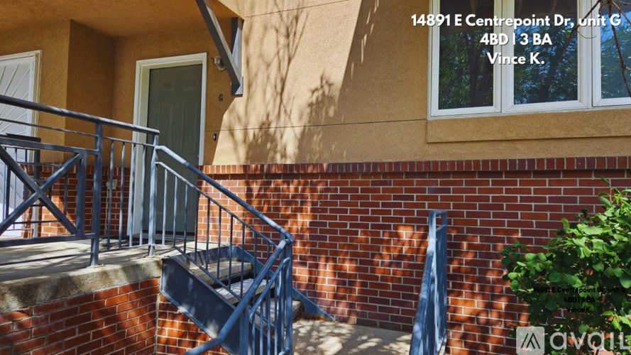 A brick building with a window and a door.