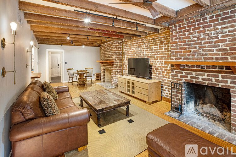 A living room with a fireplace and a couch.