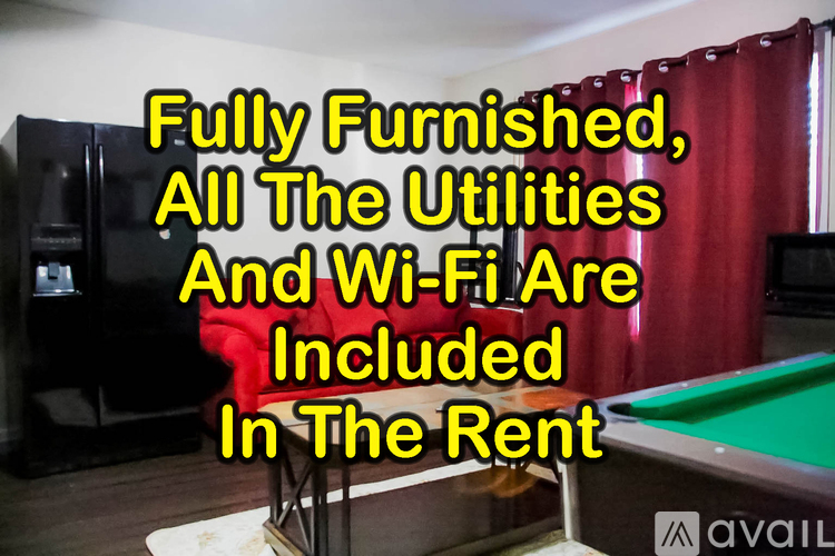 A room with a billiard table and a refrigerator, with text overlay stating amenities included in the rent.