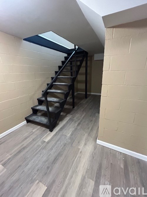 A staircase with a skylight above it.