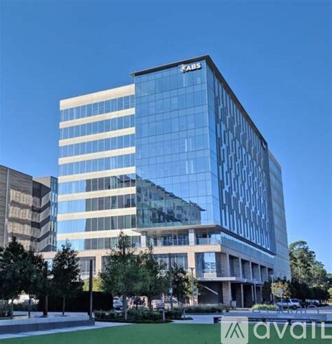 A modern building with the logo "KAIS" on the top left corner.