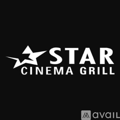 A black background with white text that reads "STAR CINEMA GRILL" and a logo above the text.