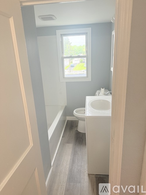 A bathroom with a toilet and sink.