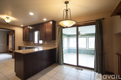 A kitchen with a counter and a sink.