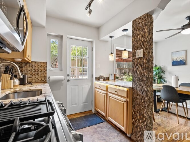 A kitchen with a stove top oven and a counter top.