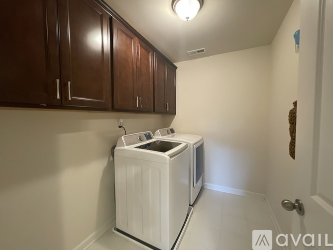 A small room with a washer and dryer in it.