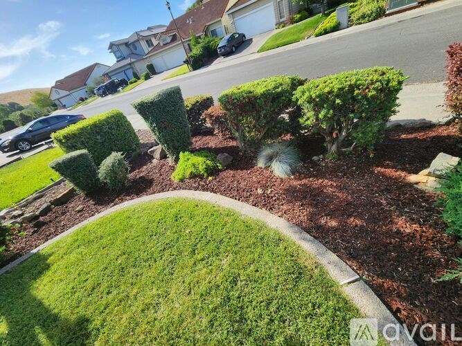 A wooden deck with a glass door and windows.