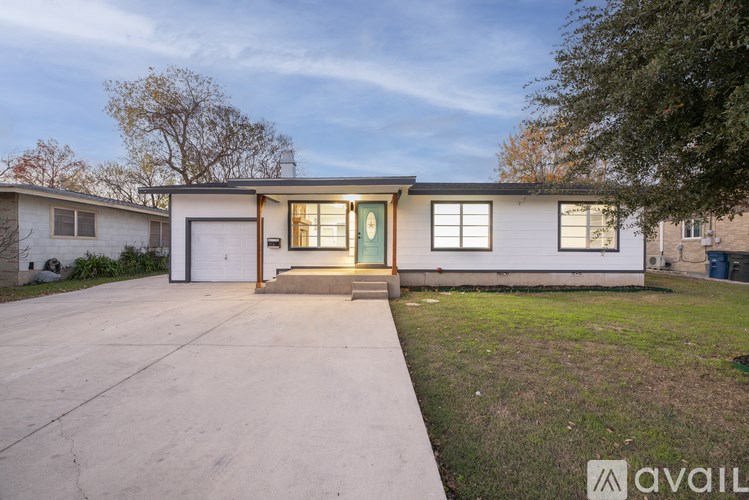 A house with a driveway in front of it.