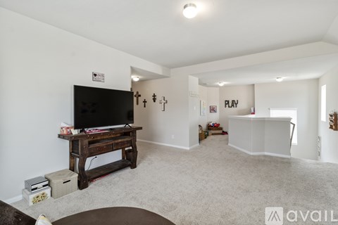 A living room with a television and a coffee table.
