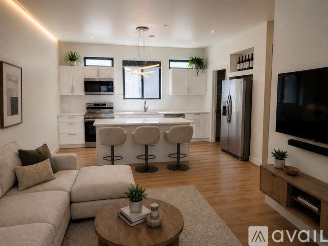 A modern house with a large front yard is for sale.