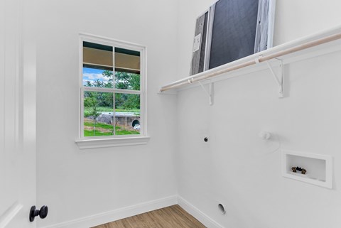 A room with a window and a door.