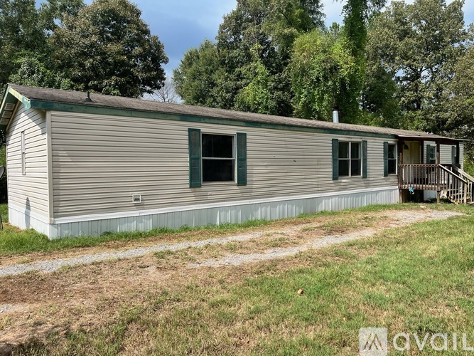 A house with a green window is for sale.