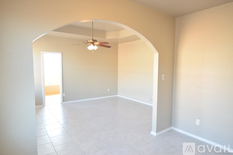 A white bathroom with a tub and sink.