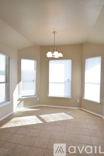 A kitchen with a sink and a window.